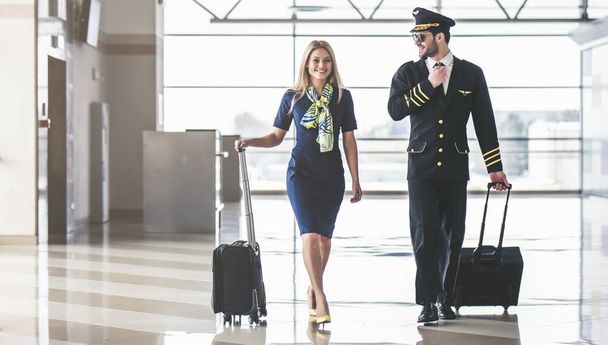 Pilot and flight attendant in airport - Photo, Image