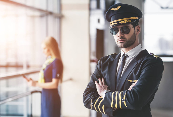 Pilot and flight attendant in airport - 写真・画像