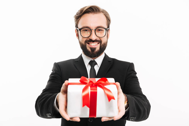 Handsome businessman gives you a gift present box. - Photo, image