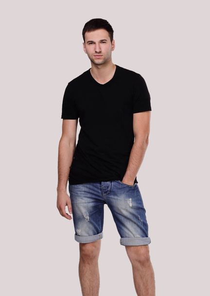 stylish guy in shorts and a t-shirt - Fotó, kép