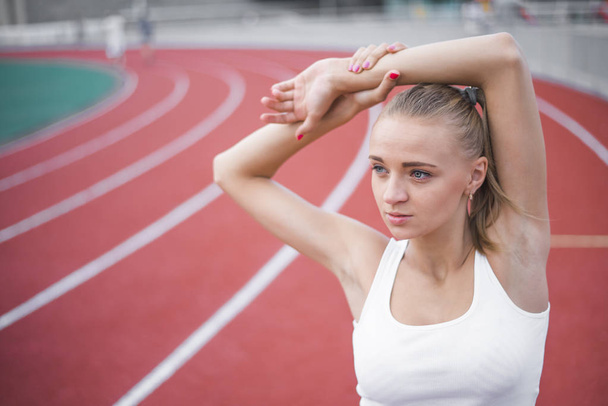 Woman  runner stretching before workout - Photo, Image