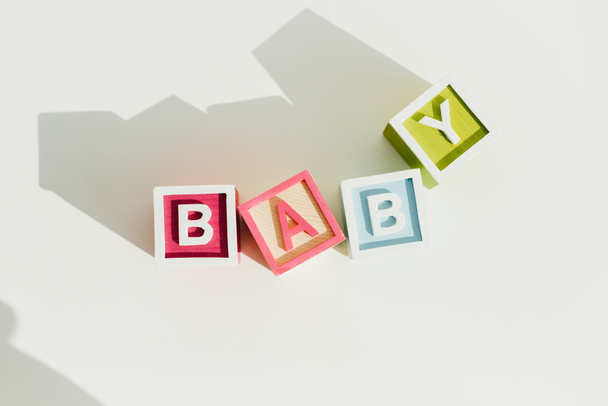 Top view of word baby on letter wooden blocks - Fotó, kép