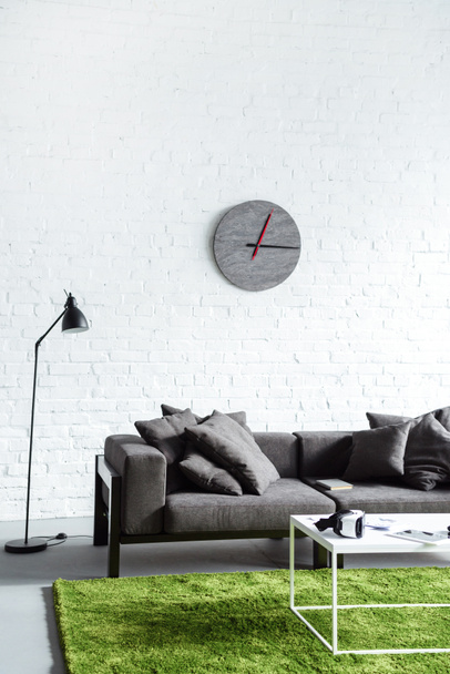 Digital gadgets in cozy interior with modern grey sofa - Valokuva, kuva