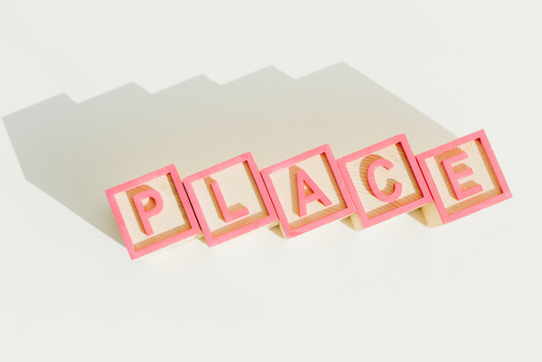 Top view of word place on letter wooden blocks - Photo, Image