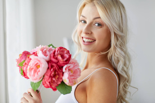 close up of woman with bunch of flowers - Foto, Imagem