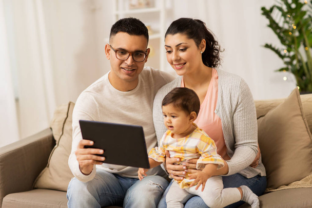 mother, father and baby with tablet pc at home - Valokuva, kuva