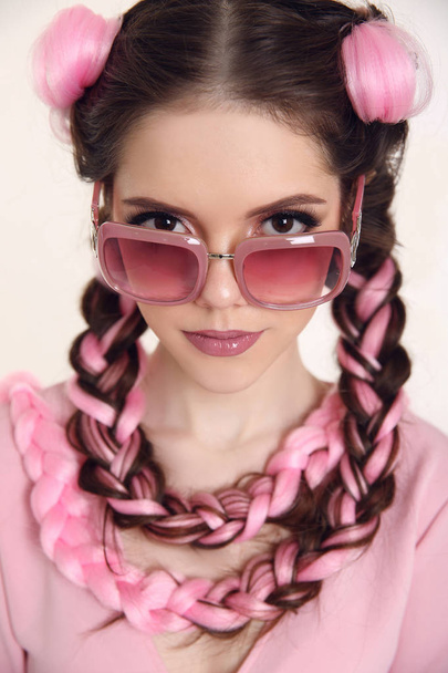 Brunette teen girl with two french braids from pink kanekalon, f - Zdjęcie, obraz