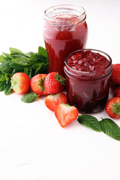 Fresh strawberry jam for breakfast and strawberries. - Photo, Image