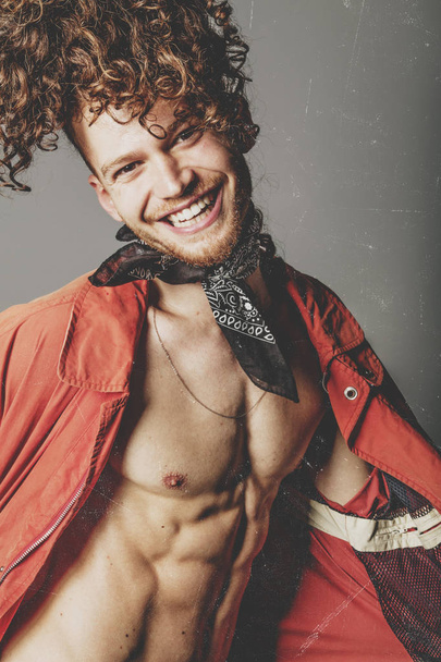 Young and attractive and muscular ginger man smiling - Photo, Image