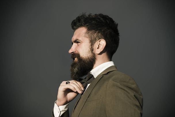 Man with beard and mustache on dark grey background. - Zdjęcie, obraz