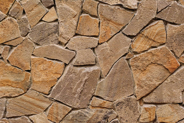 Decorative modern stone wall of chipped stone for background - Foto, afbeelding