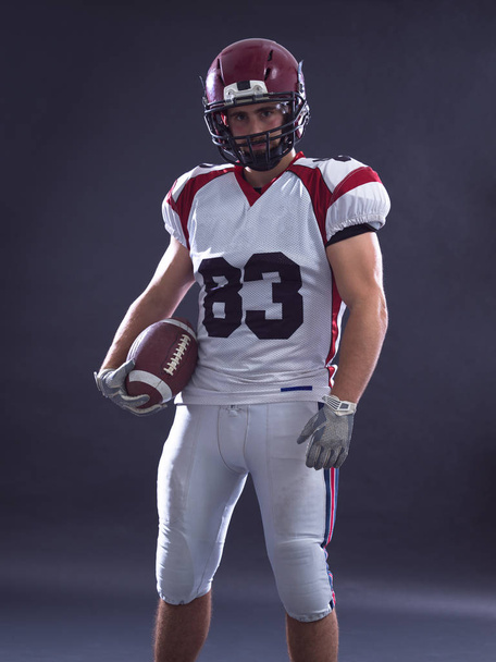 American Football Player isolated on gray - 写真・画像