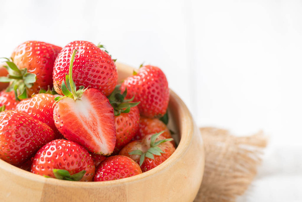 fresh sliced Red berry strawberries in wood bowl  - Zdjęcie, obraz