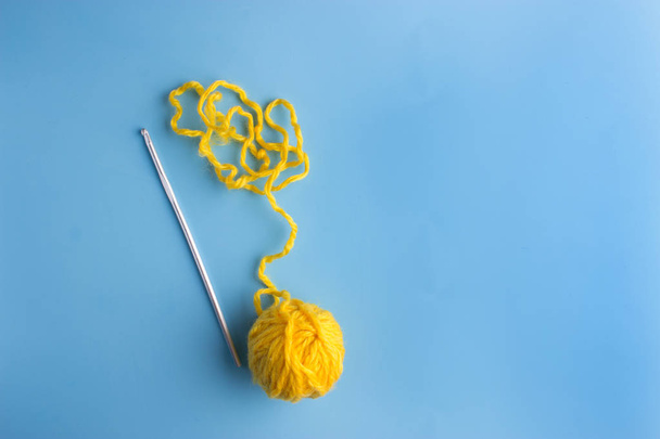 top view of blue and knitting yarn balls - Фото, изображение