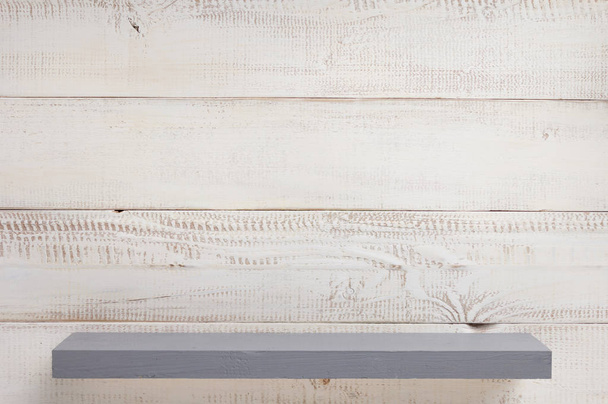 shelf at white plank wooden background - Fotó, kép