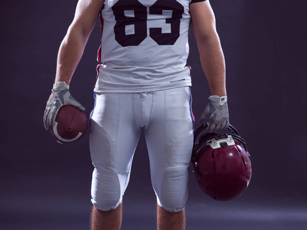 closeup American Football Player isolated on gray - Foto, afbeelding