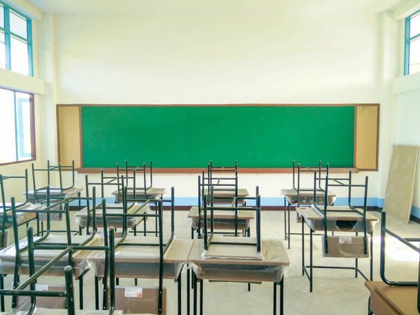 empty classroom with blackboard and desk,back to school concept - Фото, изображение