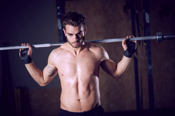 male crossfitter workout at fitness club - Fotó, kép