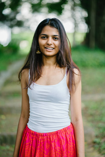 Portrait of attractive, young Indian (Asian) woman in a park in the day. - Foto, Imagem