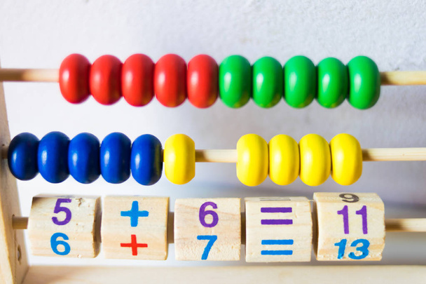 wooden cubes with numbers and colorful toy bricks - Foto, Imagem