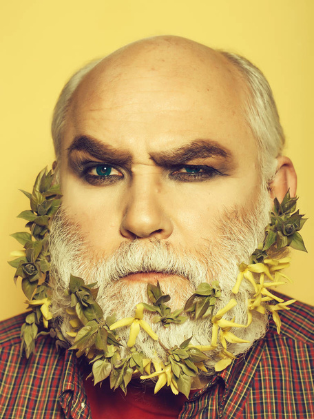 old man with flowers and leaves in beard - Valokuva, kuva