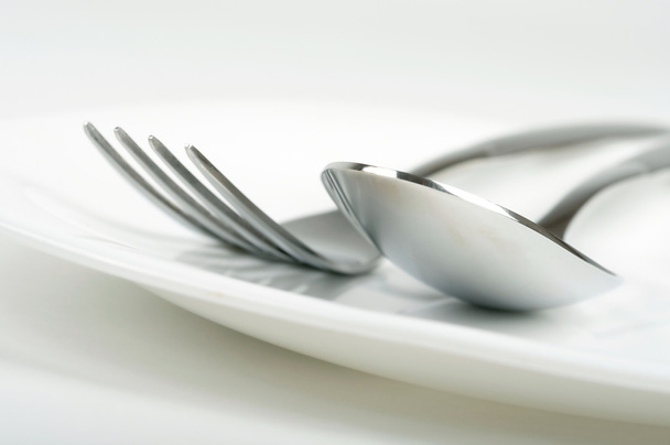 Photo of fork and spoon on plate - Φωτογραφία, εικόνα