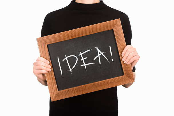 Cropped image of woman holding chalkboard with lettering idea isolated on white - Φωτογραφία, εικόνα