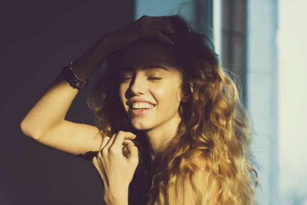 portrait of happy woman with long wavy hair - Фото, изображение