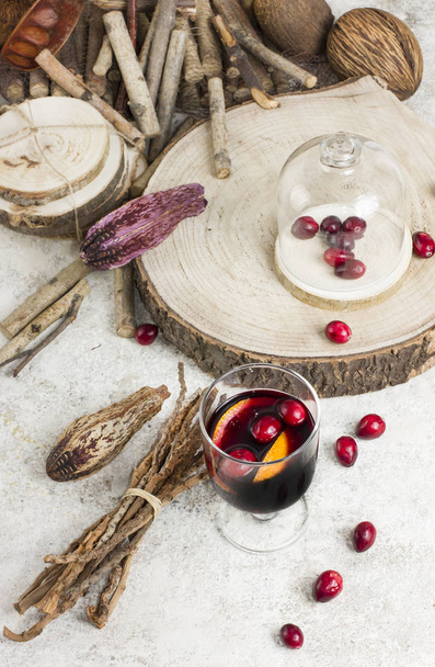 Warm mulled wine with citrus, cranberries  and spices with woode - Photo, Image