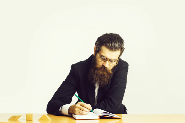 bearded man teacher at table - 写真・画像