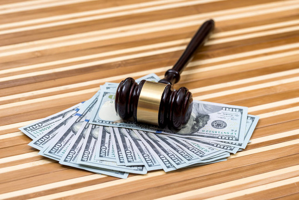 wooden gavel with dollar banknote on desk - Photo, Image