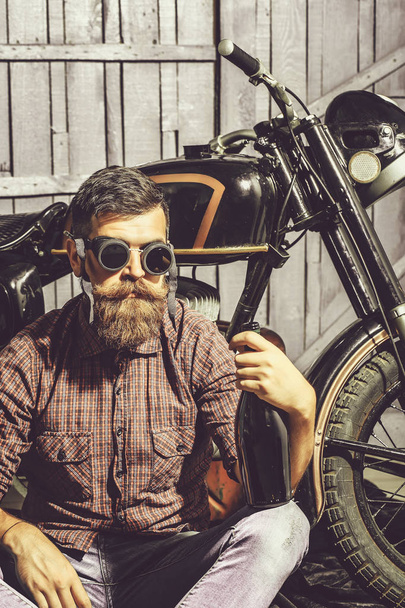 bearded biker man with bottle - Foto, Imagem