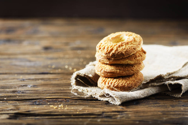 Sweet homemade cookies on wooden table - Valokuva, kuva