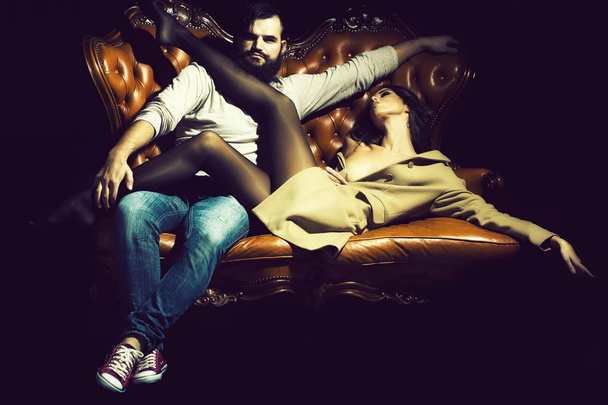 Stylish sexual couple on sofa - Foto, immagini
