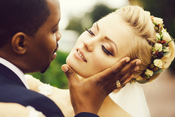 Groom touches face of bride - Photo, image