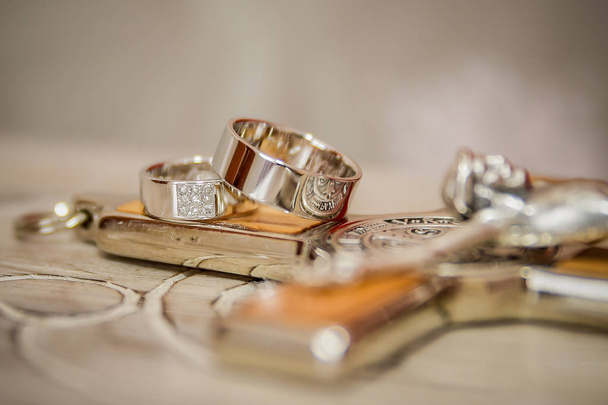 wedding rings. gold ribbons. rings. gold and silver. - Photo, Image