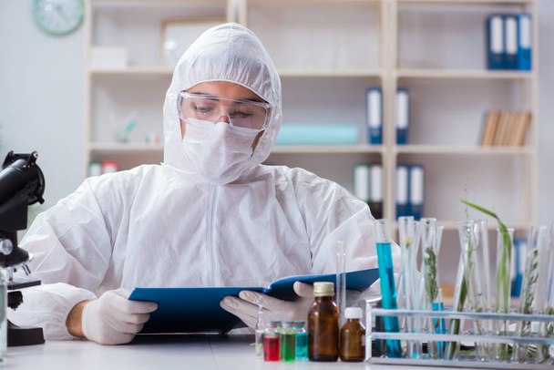 Biotechnology scientist chemist working in lab - Photo, Image