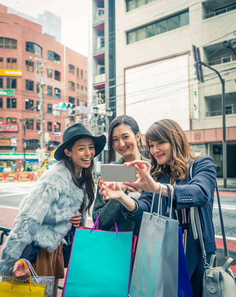 Women shopping in Tokyo - Photo, Image