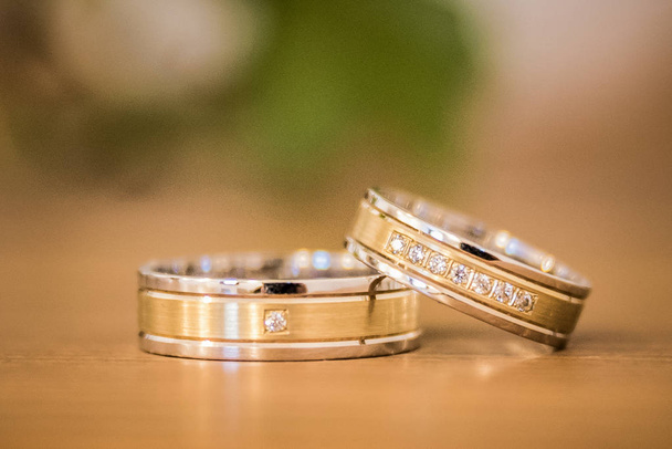 wedding rings. gold ribbons. rings. gold and silver. - Photo, Image