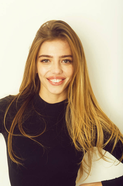 sexy pretty smiling girl with long blond hair in black - Fotoğraf, Görsel