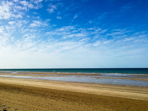 Deep Oman beach sky overcasted with clouds, blue sky with fainte - Photo, Image