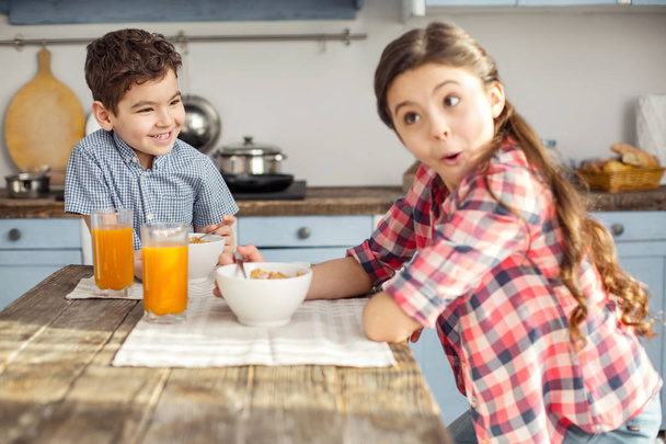 Inspired brother and sister having healthy breakfast - Photo, image