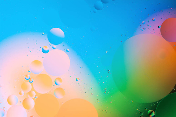 mixing water and oil, beautiful color abstract background based on circles and ovals - Фото, изображение