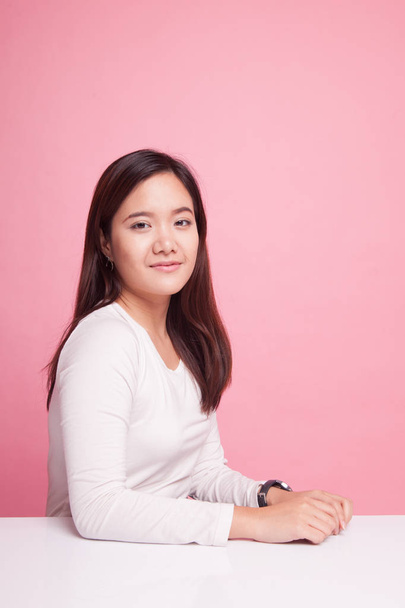 Beautiful young Asian woman  smiling  on pink background - Photo, image