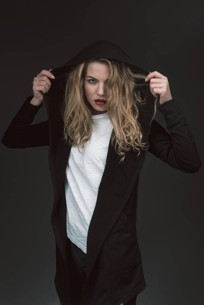 Serious young woman posing in modern clothes - Fotografie, Obrázek