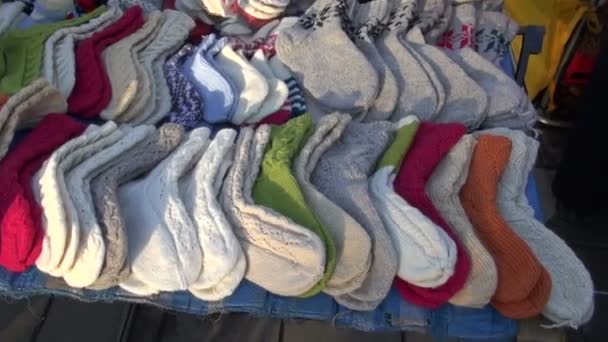 Handmade knitted socks in street market - Footage, Video