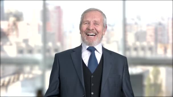 Aged man in formal wear is laughing. - Video, Çekim