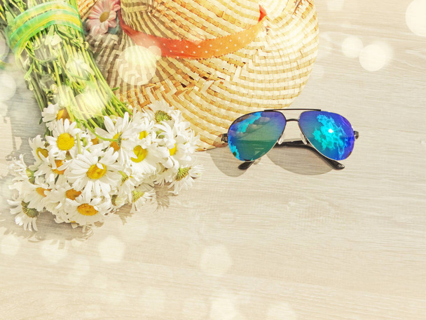 sunglasses hat and daisy flowers summer holiday background  - Photo, Image