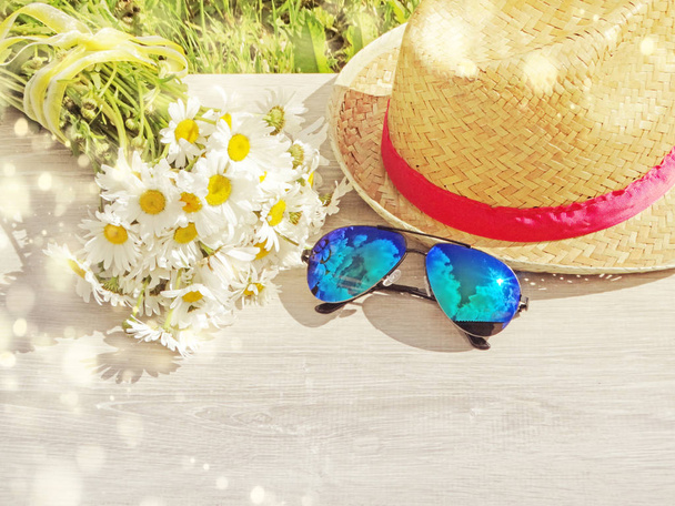 sunglasses hat and daisy flowers summer holiday background  - Photo, Image