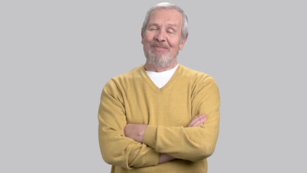 Smiling elderly man on grey background. - Footage, Video
